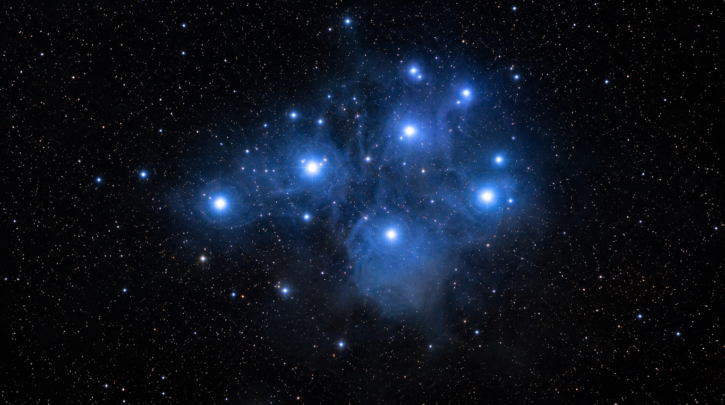 A dense star cluster glowing against the dark night sky